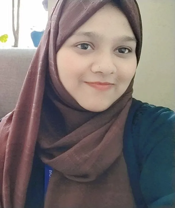 Real estate agent closing deal with couple indoors, all wearing face masks for safety.