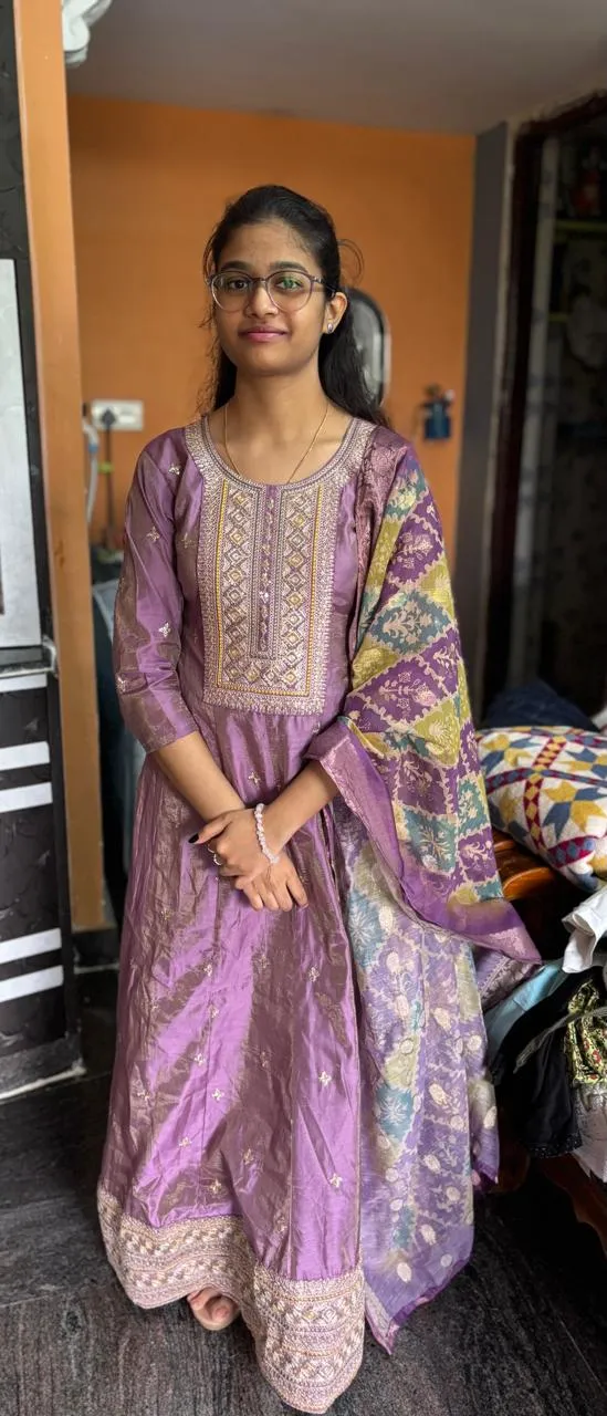 A joyful group of diverse graduates celebrating their success with family.