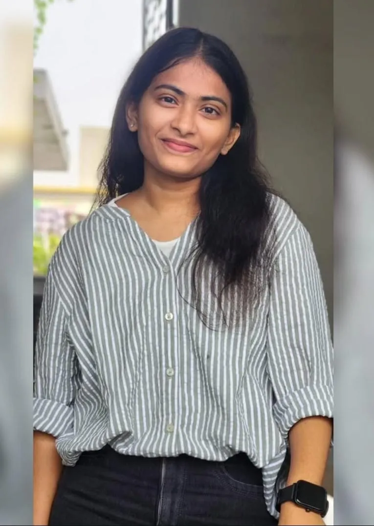 A joyful group of diverse graduates celebrating their success with family.