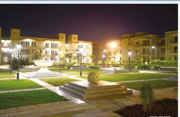 Aerial view of illuminated office building and parking lot at night in Woodbridge Township, NJ.