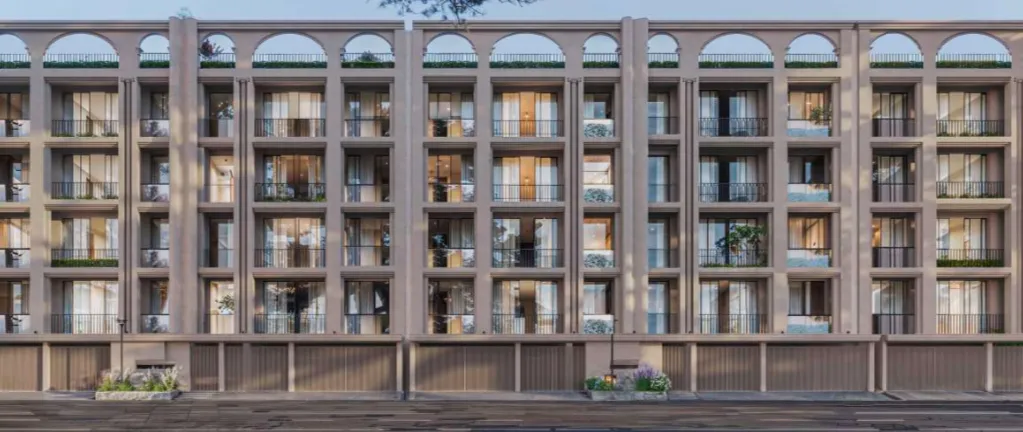 Aerial view of illuminated office building and parking lot at night in Woodbridge Township, NJ.