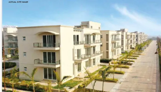 A contemporary building showcasing geometric design and wooden accents against a clear blue sky.