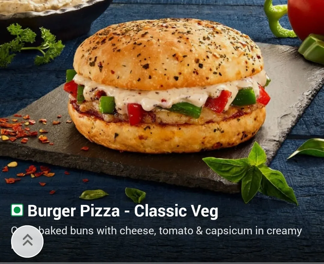 Young woman savoring a slice of pepperoni pizza in a casual setting.