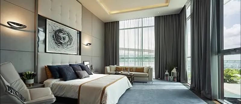 A modern, minimalist cafe interior featuring wooden furniture and potted plants.