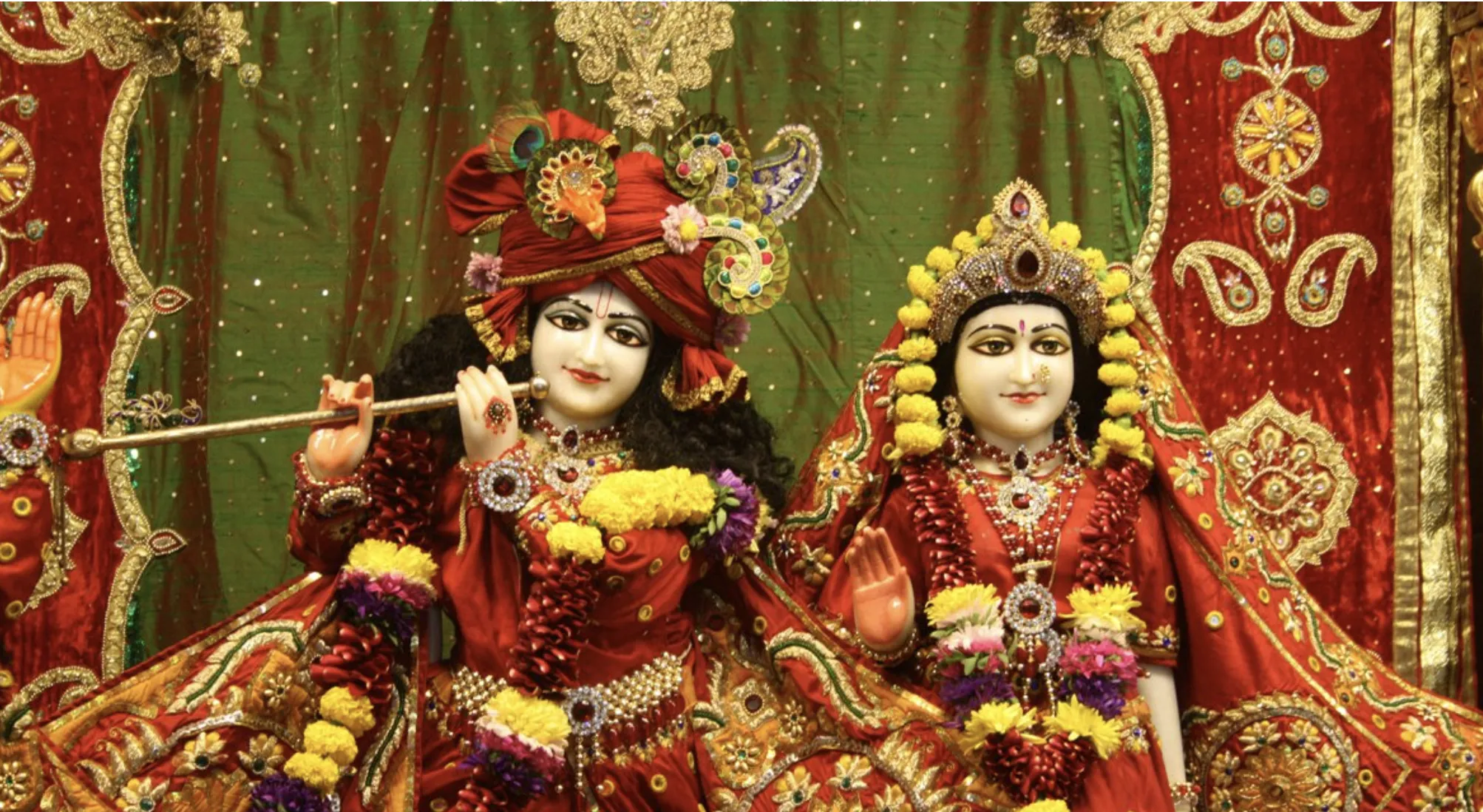 Intricate decoration of a colorful festival deity in Dhaka, showcasing traditional artistry.