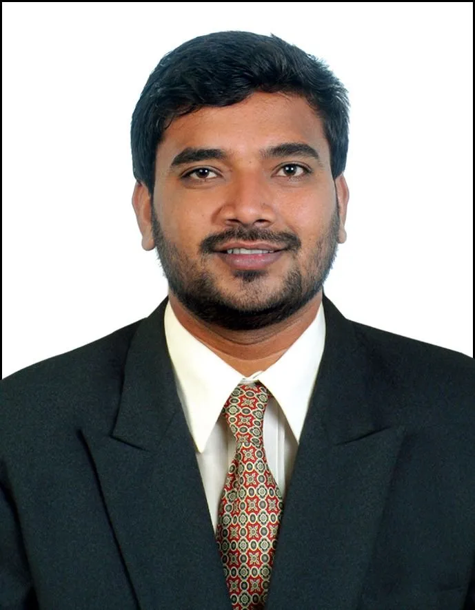 A group of diverse clients with a realtor at a new construction site entrance.